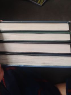 A set of..the first 4 dog man book by Dav pilkey