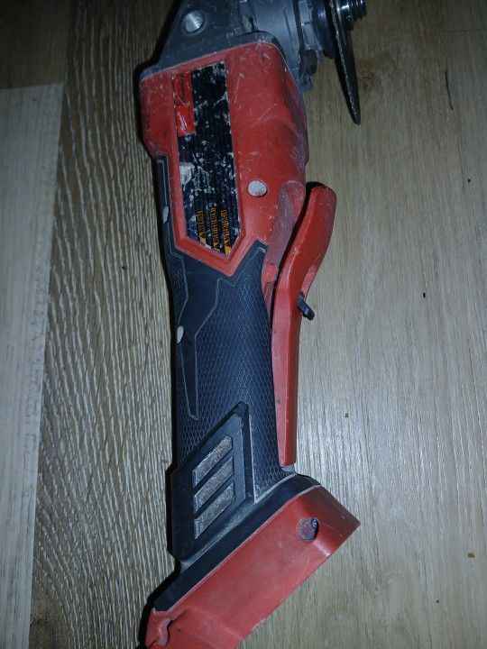 Milwaukee Grinder And A Xc6.0 Battery