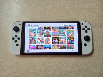 NINTENDO SWITCH OLED Loaded With 120 Popular Switch Games