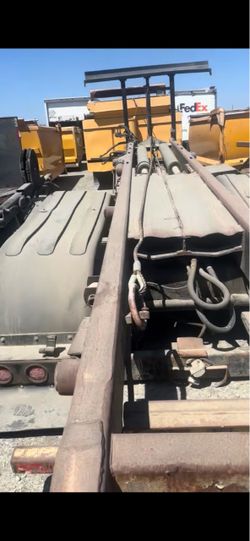 Roll-off dumpster unit trucks