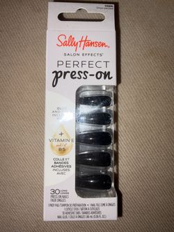 Black fake nails with glue and tabs