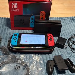 Nintendo switch with docking station, case and box. 
