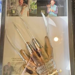 SIGNED FREDDY KRUGER GLOVE BY ROBERT ENGLUND AND HEATHER LAGENKAMP WITH CERTIFICATE OF AUTHENTICITY