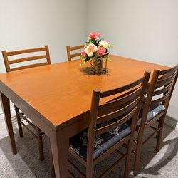 Wooden dining table with chairs