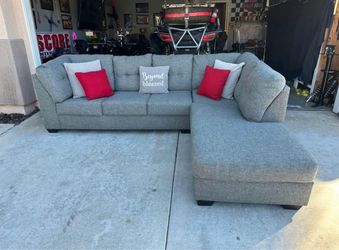 Gorgeous gray sectional couch with pull out bed!!