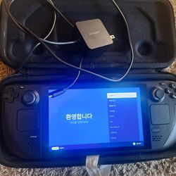 Steam Deck 64gb With 60 gb SD card, AC Adapter and Case