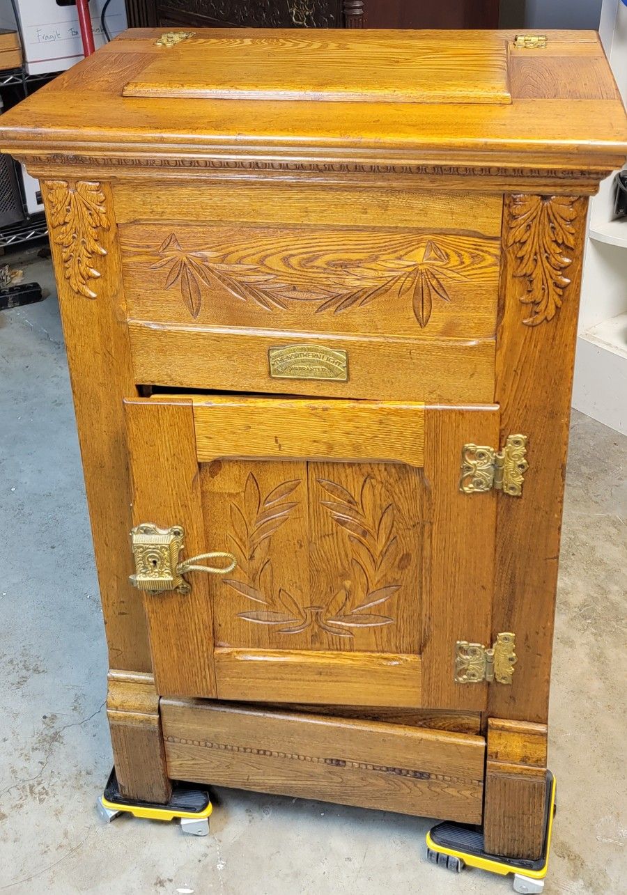 Antique icebox cabinet, manufactured by The Northern Light Company