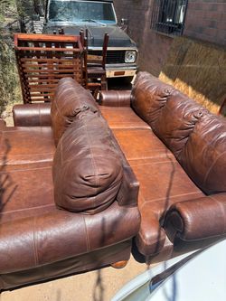 Brown real leather couches and tables