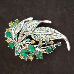 Leaf brooch with green & yellow tone stones