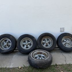 GRAGAR WHEELS AND TIRE SET WITH A SPARE 8 1/2 “X 14” FROM MY PONTIAC TRANS AM WITH THE CAPS SEE PICTURES 