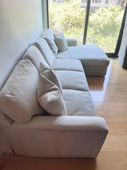 Cream/linen down feather living spaces sectional chaise sofa (delivery available)