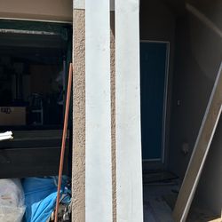 Two matching white long wall shelving units
