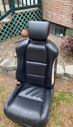 Black Acura TL driver seat.