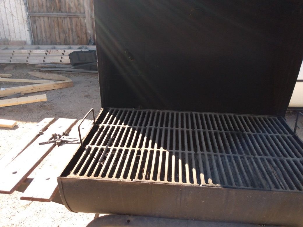 Charcoal grill with smoker works