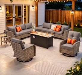 Gray Wicker patio conversation set with Dark Gray Cushions and Swivel Chairs and Rectangle Fire Pit