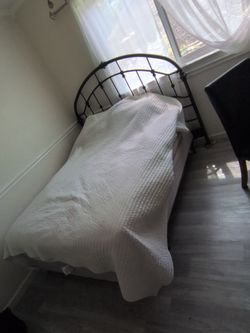 Iron queen bed frame with mattress and box spring