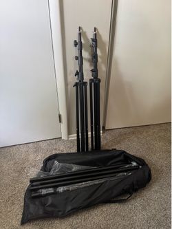 BRAND NEW Tripod stands. 9ft with travel case and poles for back drop.