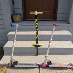 2 Razor Scooters And 1 Pogo Stick
