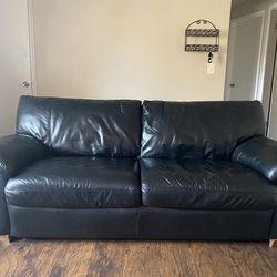 Black leather sofa bed