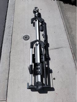 Thule UpRide 599 roof-mounted bike rack in good working condition.