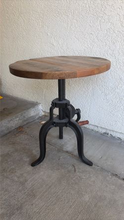 Wood and iron adjustable end table.