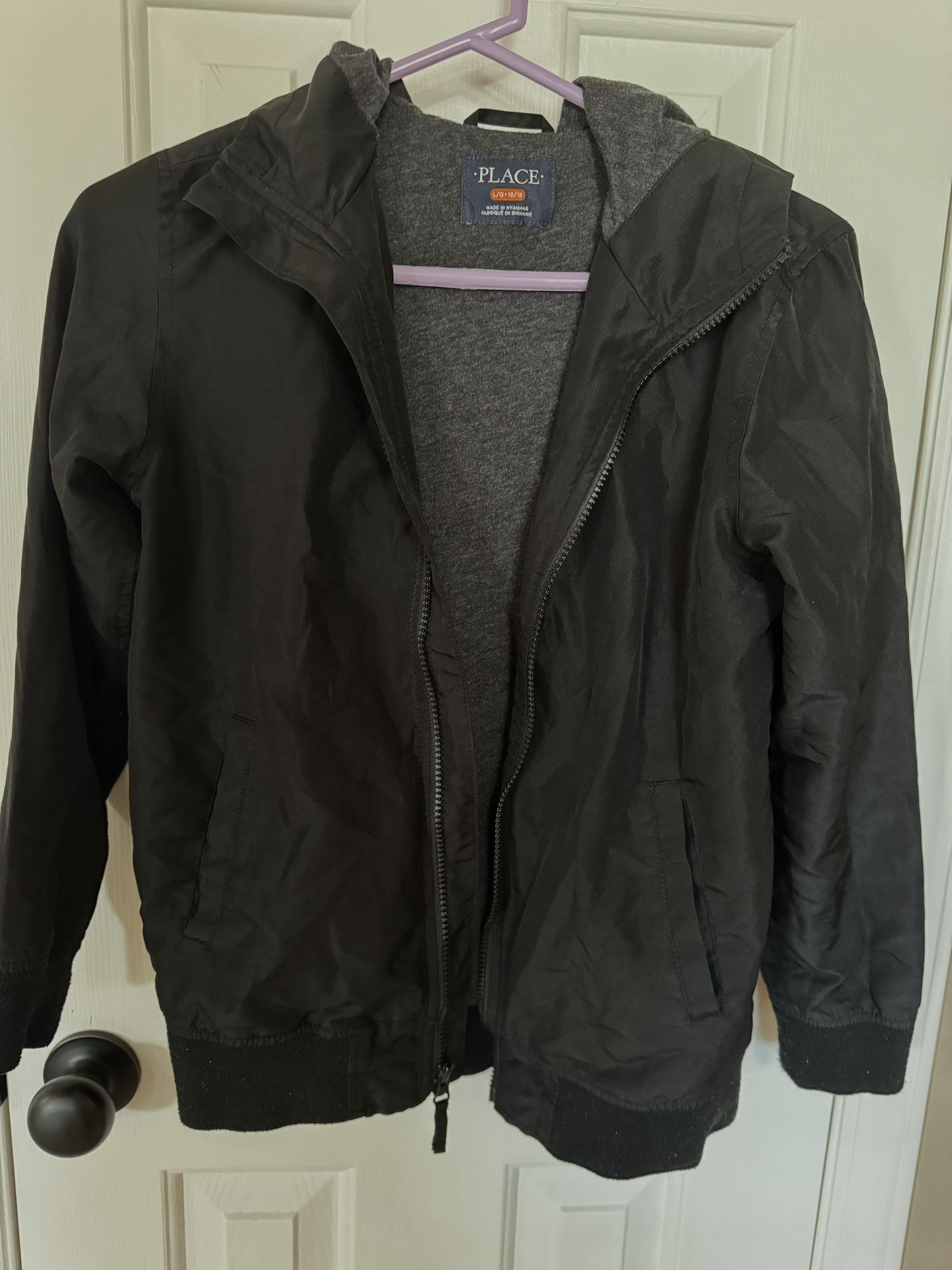 Youth 10-12 Nice Black Jacket with zipper, hood and 2 side pockets. See more below.