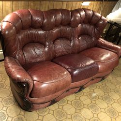 Beautiful cherry red colored curvy wood and leather pull-out couch sofabed antique classic style