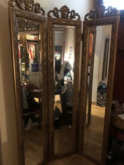 Three mirrored antique