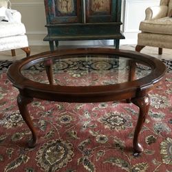 Queen Ann glass top coffee table with carved Cabriole legs.