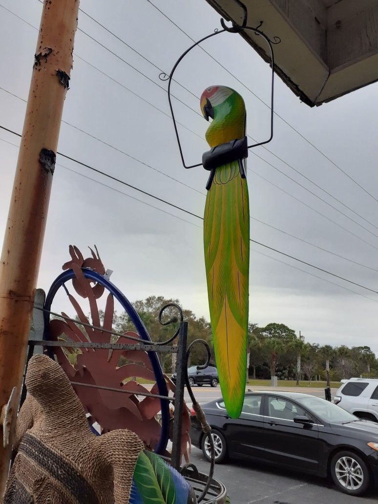 Really Large Colorful Wooden Parrot On A Swing From Indonesia
