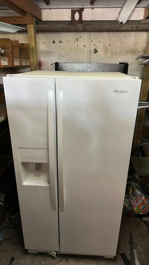 White Whirlpool Refrigerator with Water Dispenser