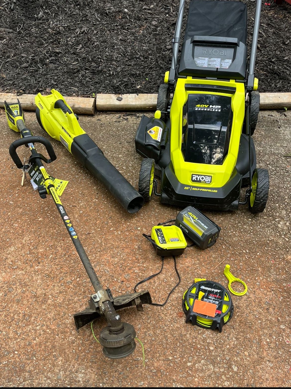 Ryobi 40 V 20 inch self-propelled mower string trimmer leaf blower battery charger 300