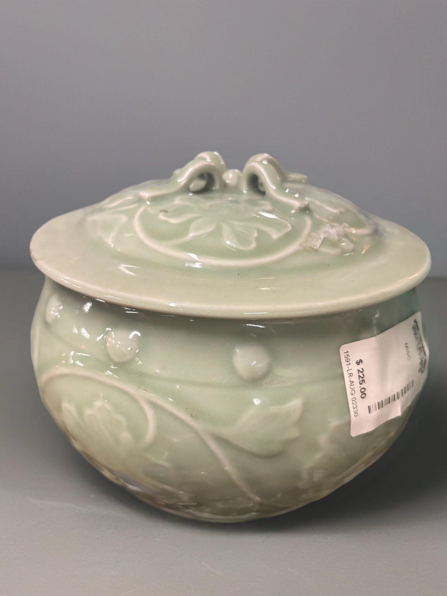 Chinese Celadon Peony Cover Jar, also referred to as a Vintage Chinese Celadon Porcelain Relief Flower Lidded Pot Jar.
