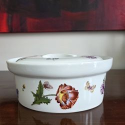 A BIA Cordon Bleu lidded casserole dish with floral and butterfly decoration.