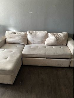 White couch that turns into a bed