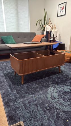 Coffee table with hidden compartment