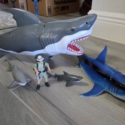 4 Sharks and one shark hunter figure