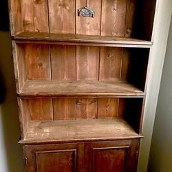 Nice shelving with large cabinet on the bottom. Has a couple scratches you can always refurbish it. In  very good condition. ( 72Hx12 Dx 35W)