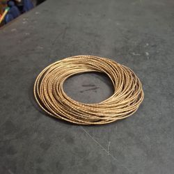 Guitar String Bracelet Stack, Textured Sparkling Goldtone Intertwined Coiled Steel Bangles (Approx 30) Vintage Late 20th Century