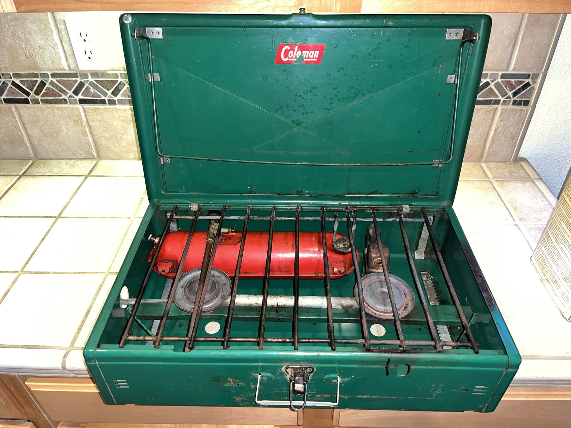 The Coleman 413E huge two-burner camp stove good condition. Come with fuel 3/4 Full
