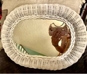 Adorable white wicker mirror tray or wall hanging.