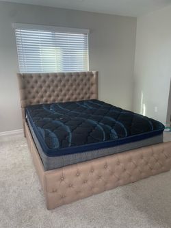 Queen sized bed with mattress