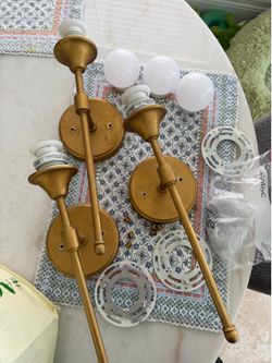 3 wall sconces with rechargeable bulbs