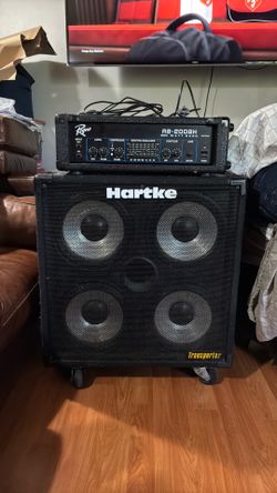 Rogue RB-200BH head and a Hartke Transporter 410 speaker cabinet.