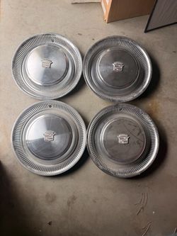 74-76 Cadillac hubcap set