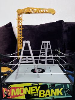 WWE money in the bank ring with ladders and structures