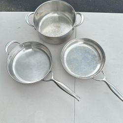 Three Stainless Steel Pots and Pans 