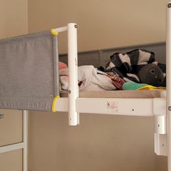 Used bunk bed in excellent condition, white, includes the base but not the mattress.