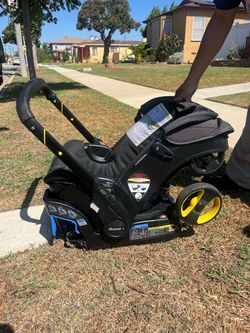 Doona+ Infant Car Seat Stroller+car seat base and diaper bag