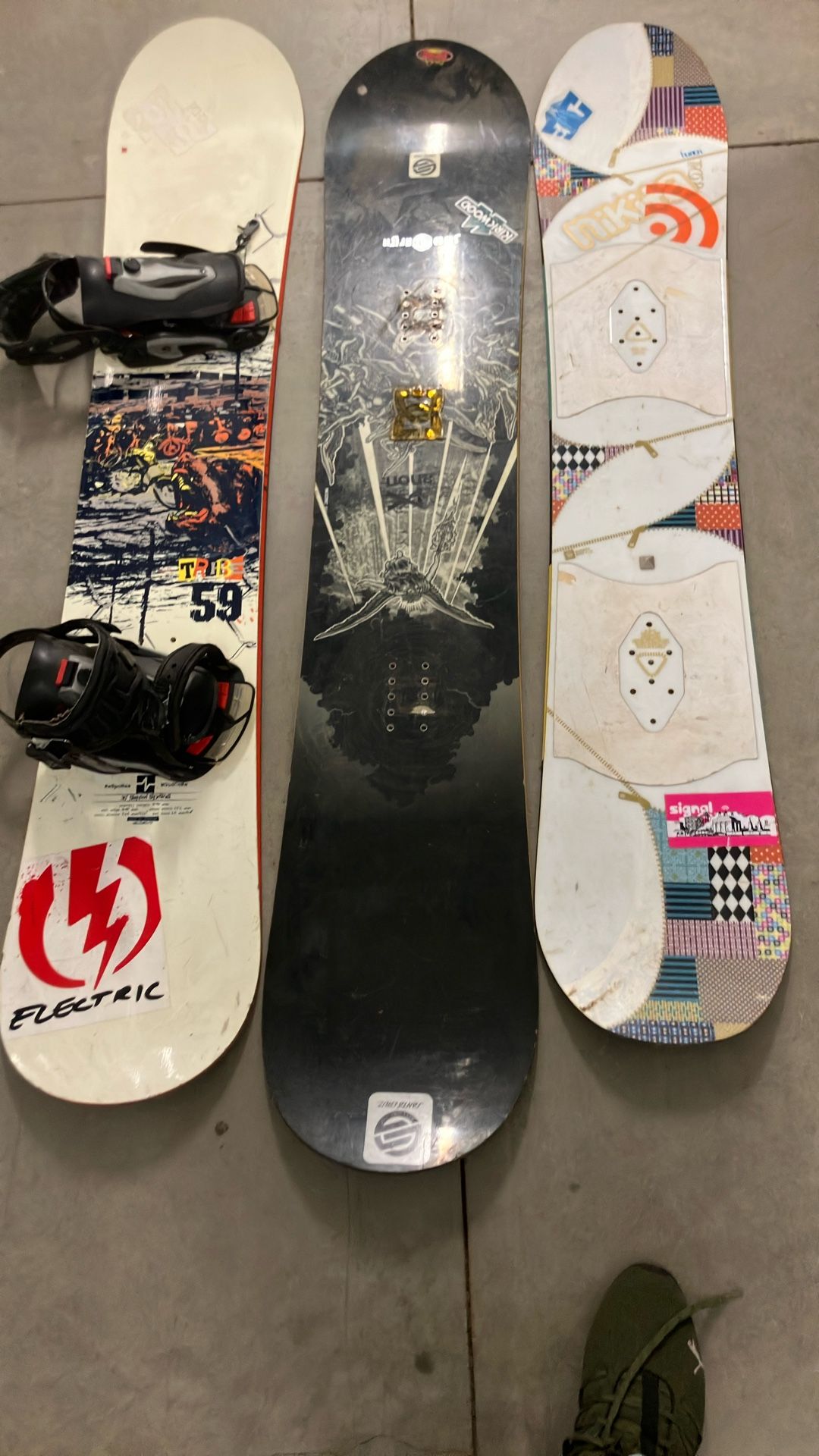 Three Snowboards Elan Burton And Santa Cruz